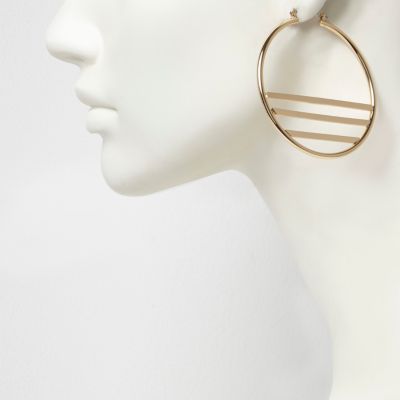 Gold tone lined hoop earrings